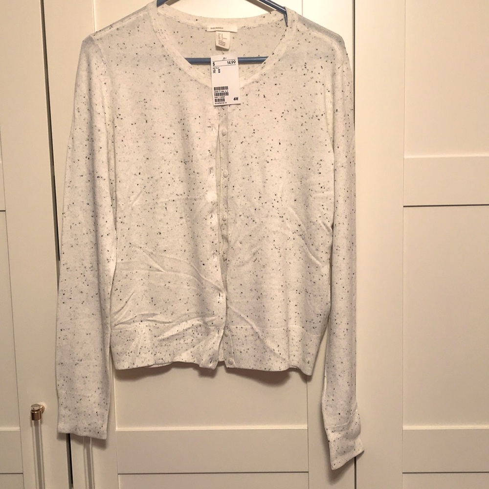 White cardigan with black and grey specks